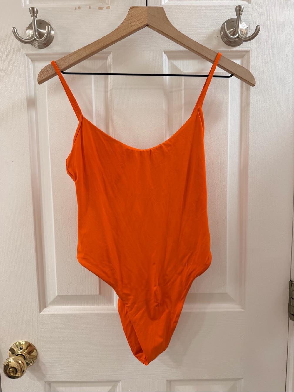 Toast Swim orange one piece swimsuit in size M.